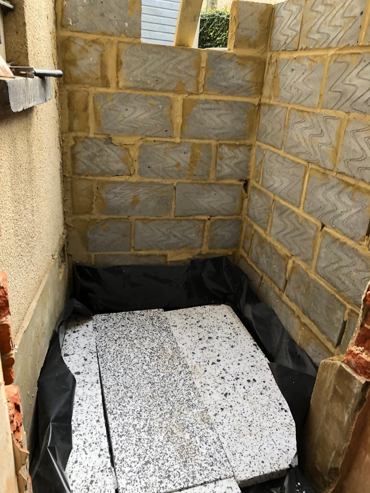 Single-storey rear house extension under construction in London with new blockwork walls by Refurb Squad