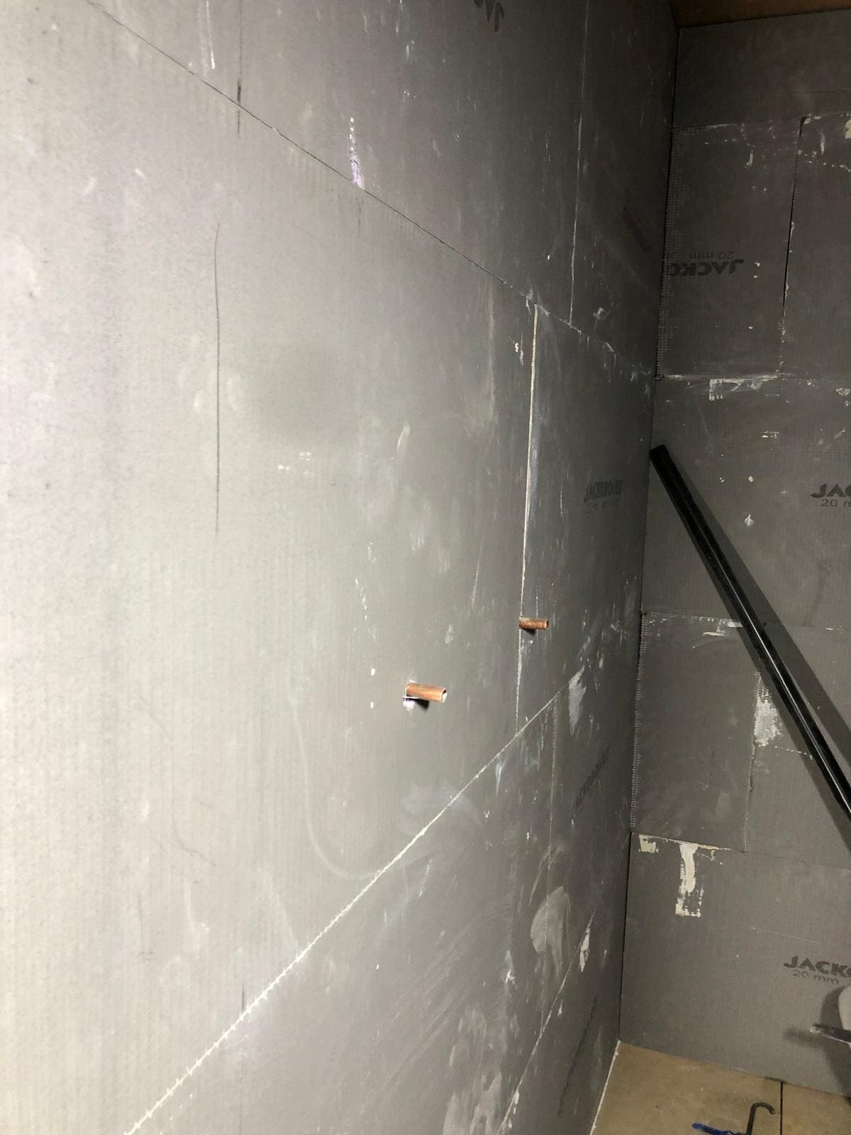 Bathroom substrate preparation in a London property with tanking membrane on walls ready for tiling